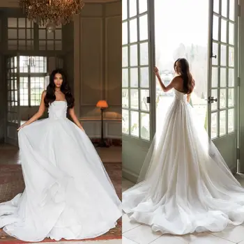 Великолепные, очень пышные белые свадебные платья с тюлевыми оборками и воланами, свадебные платья трапециевидной формы, вечернее платье на шнуровке